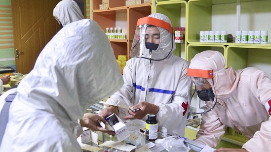 Members of the North Korean army supply medicines to residents at a pharmacy, amid growing fears over the spread of Covid-19, in Pyongyang, on May 18, 2022.&nbsp;(Kyodo via REUTERS)