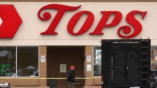 A Member of the FBI search for evidence at the scene of a weekend shooting at a Tops supermarket in Buffalo, New York, on May 18, 2022.&nbsp;(REUTERS)