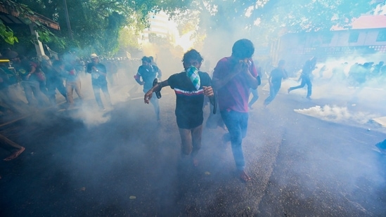Police use tear gas to disperse university students protesting to demand the resignation of Sri Lanka's President Gotabaya Rajapaksa over the country's crippling economic crisis, in Colombo.(AFP)