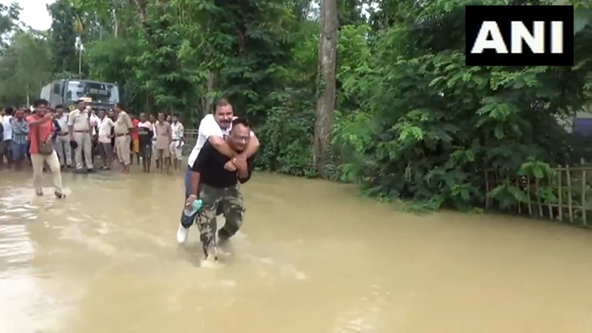 BJP MLA Sibu Misra gets piggyback ride from flood rescue worker in Assam's Hojai district. (Screengrab/ANI video) BJP MLA Sibu Misra gets piggyback ride from flood rescue worker in Assam's Hojai district. (Screengrab/ANI video)