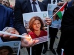 People light candles during a vigil in memory of Al Jazeera journalist Shireen Abu Akleh, who was killed during an Israeli raid, outside the Church of the Nativity in Bethlehem, in the Israeli-occupied West Bank.
