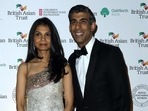 Britain's Chancellor of the Exchequer Rishi Sunak (R) poses with his wife Akshata Murty. Britain's Chancellor of the Exchequer Rishi Sunak (R) poses with his wife Akshata Murty.