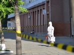 In this photo provided by the North Korean government, a worker in protective gear stands on an empty sidewalk in Pyongyang, on May 17, 2022. In this photo provided by the North Korean government, a worker in protective gear stands on an empty sidewalk in Pyongyang, on May 17, 2022. 