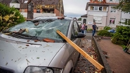 A roof batten is stuck in the windshield of a parked car in Paderborn, western Germany.