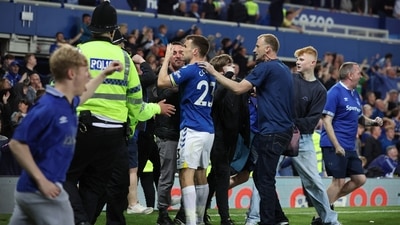 Everton v Crystal Palace - Goodison Park, Liverpool, Britain - May 19, 2022 Everton's Seamus Coleman reacts as Everton fans invade the pitch to celebrate avoiding relegation from the Premier League&nbsp; (REUTERS)