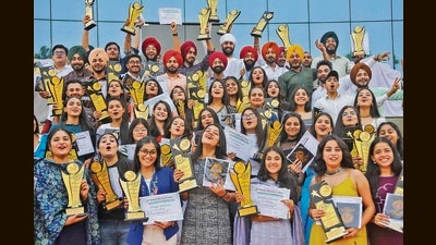 Students in a jubilant mood after being felicitated during the annual prize distribution function at GGDSD College in Sector 32, Chandigarh. (Keshav Singh/HT)