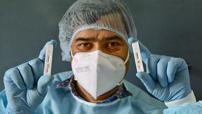 New Delhi: A healthworker shows samples after conducting COVID-19 tests, as coronavirus cases rise, at a school in New Delhi, Saturday, April 30, 2022. (PTI Photo/Ravi Choudhary)(PTI04_30_2022_000147A) (PTI)