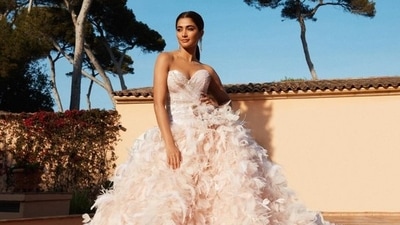 Pooja Hegde attended the Cannes Film Festival 2022 in a pink gown. Pooja Hegde attended the Cannes Film Festival 2022 in a pink gown.
