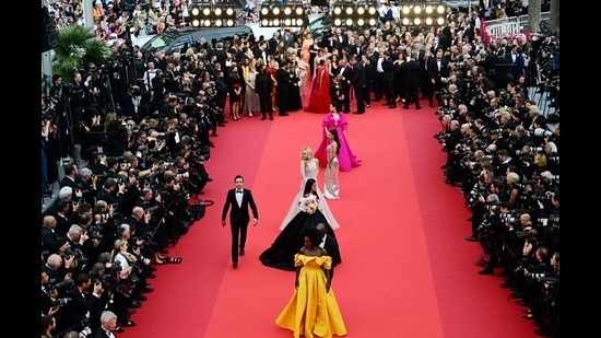 Crowds ring a red carpet at Cannes as Viola Davis, Aishwarya Rai Bachchan, Elle Fanning, Eva Longoria and Katherine Langford arrive at a premiere. (AFP)