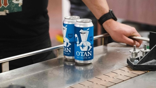OTAN beer cans are seen on the production line at the Olaf brewery poses on May 19, 2022 in Savonlinna, Finland.(AFP) OTAN beer cans are seen on the production line at the Olaf brewery poses on May 19, 2022 in Savonlinna, Finland.(AFP)