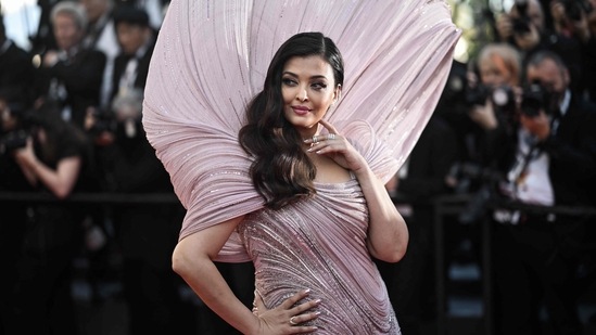 The Gaurav Gupta gown featured structured shoulders and silver embellishments.  However, the main point of her gaze was the larger structural aspect of life that rose from the shoulders and formed the giant halo behind Aishwarya's head.  This gave the illusion of a seashell opening. (AFP)