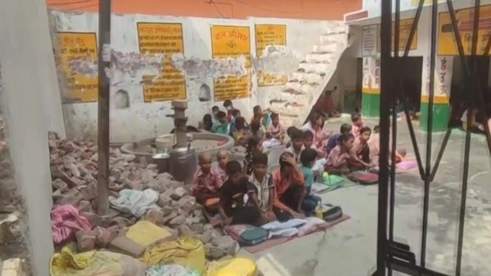 Children made to sit in the sun at a primary government school in Jayantipur, Moradabad district.(ANI) Children made to sit in the sun at a primary government school in Jayantipur, Moradabad district.(ANI)