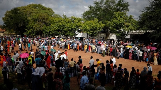 People stand next to their empty cylinders as they wait in a queue to buy domestic cooking gas, amid the country's economic crisis, in Colombo, Sri Lanka.