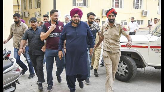 Congress leader Navjot Singh Sidhu surrenders in the CJM court in Patiala on Friday, a day after he was awarded one year in prison by the Supreme Court in a 1988-road rage case. (PTI)