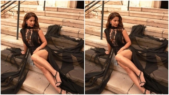 Hina’s dress featured a laced black short dress with midriff-baring details, decorated in black lace. The actor teamed it with a black satin throw and added more dreamy vibes to her look.(Instagram/@realhinakhan)