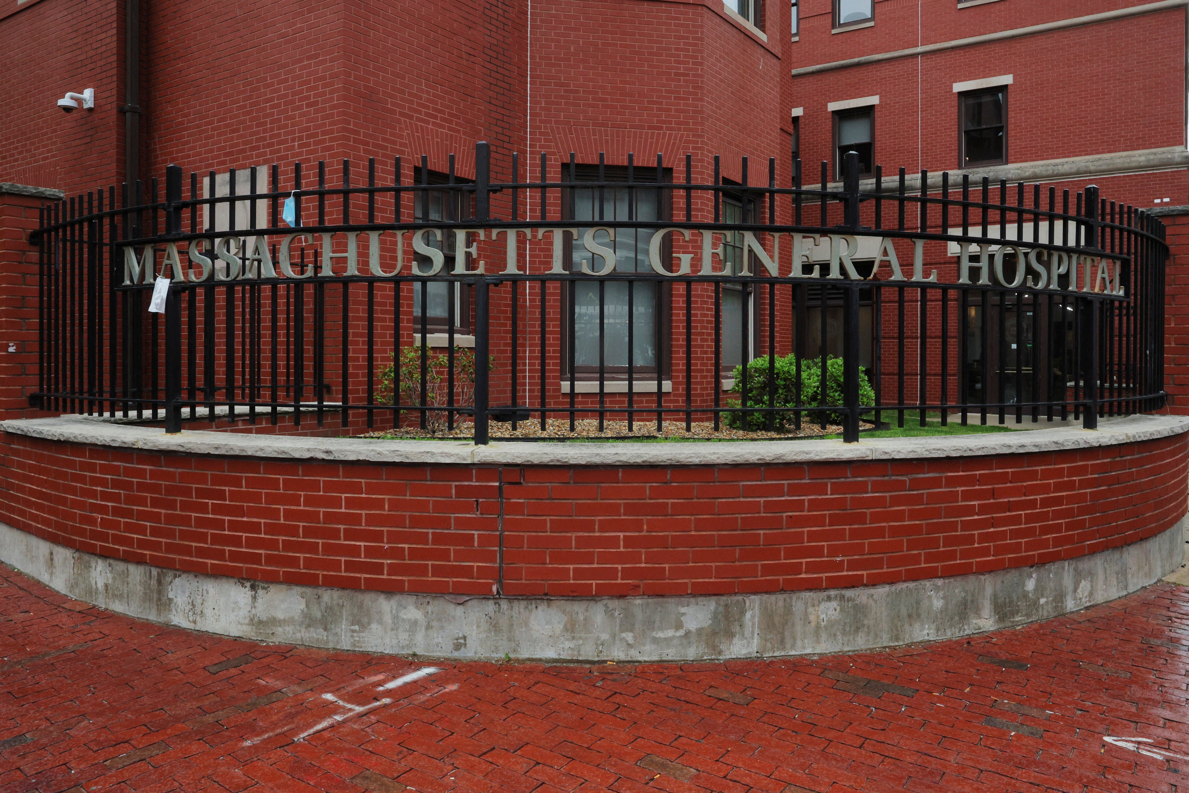 Signage for Massachusetts General Hospital, where a patient is being treated for monkeypox, is pictured on a fence at the hospital in Boston, Massachusetts, on May 19, 2022.&nbsp; (REUTERS)
