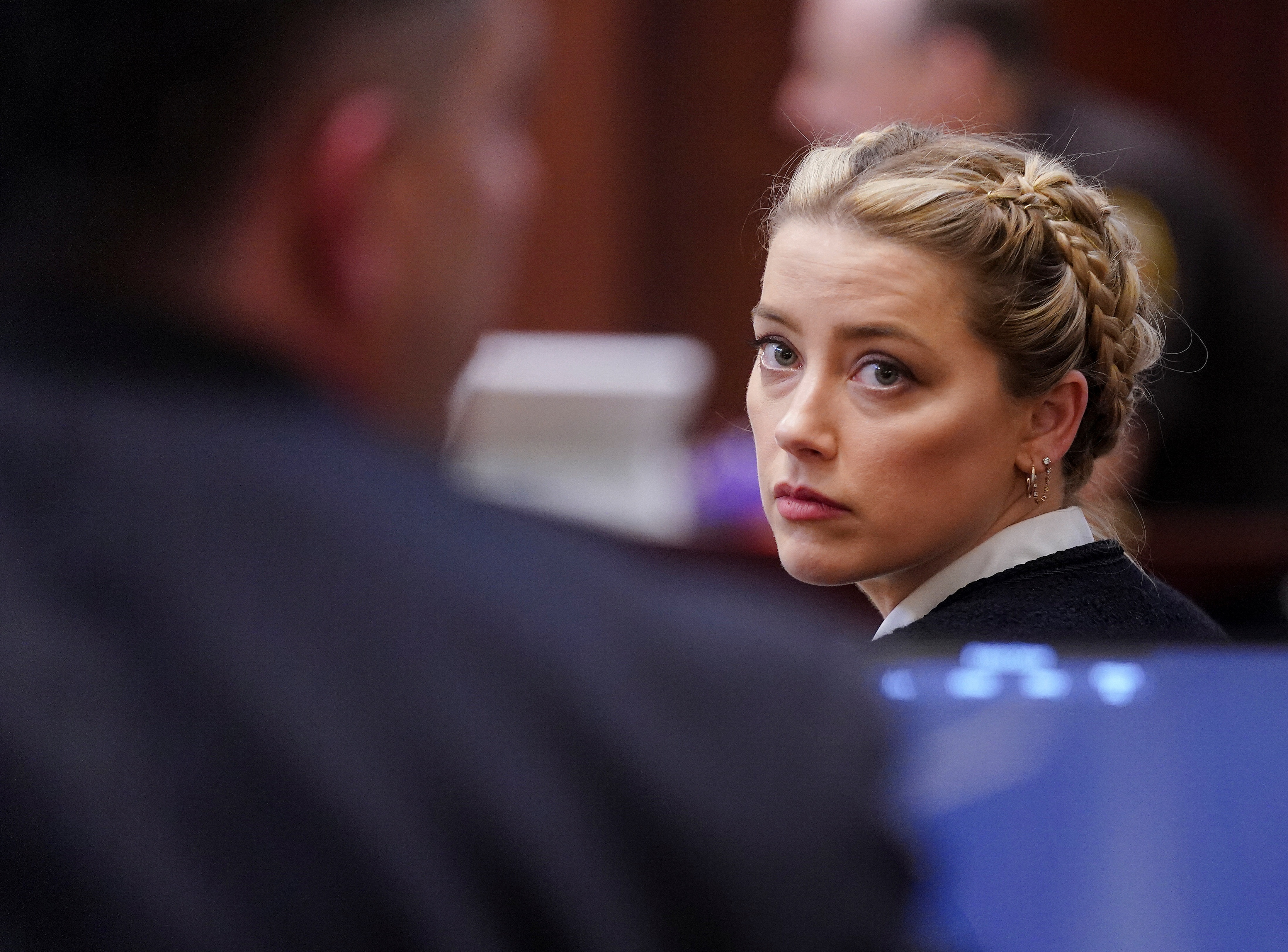 Amber Heard looks on during the trial. (REUTERS)