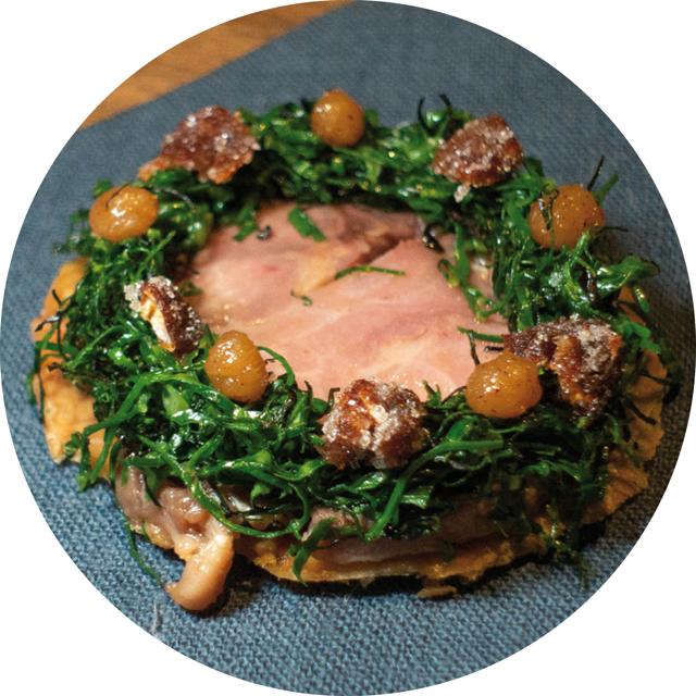 Quail terrine, grilled greens and salted plum served on crispy chicken skin at Gaa Restaurant Quail terrine, grilled greens and salted plum served on crispy chicken skin at Gaa Restaurant