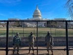 US National Guard soldiers guard the grounds of the US Capitol from behind a security fence in Washington, DC.(AFP) US National Guard soldiers guard the grounds of the US Capitol from behind a security fence in Washington, DC.(AFP)