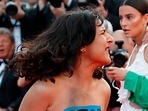 The 75th Cannes Film Festival - Screening of the film "Three Thousand Years of Longing" Out of Competition - Red Carpet Arrivals - Cannes, France, May 20, 2022. A woman reacts on the red carpet while protesting.