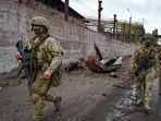 Ukraine war: Russian soldiers patrol a destroyed part of the Illich Iron &amp; Steel Works Metallurgical Plant in Mariupol, in territory under the government of the Donetsk People's Republic, eastern Ukraine,