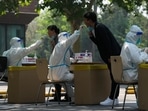 Residents get swabbed for mass Covid test in Beijing. Residents get swabbed for mass Covid test in Beijing.