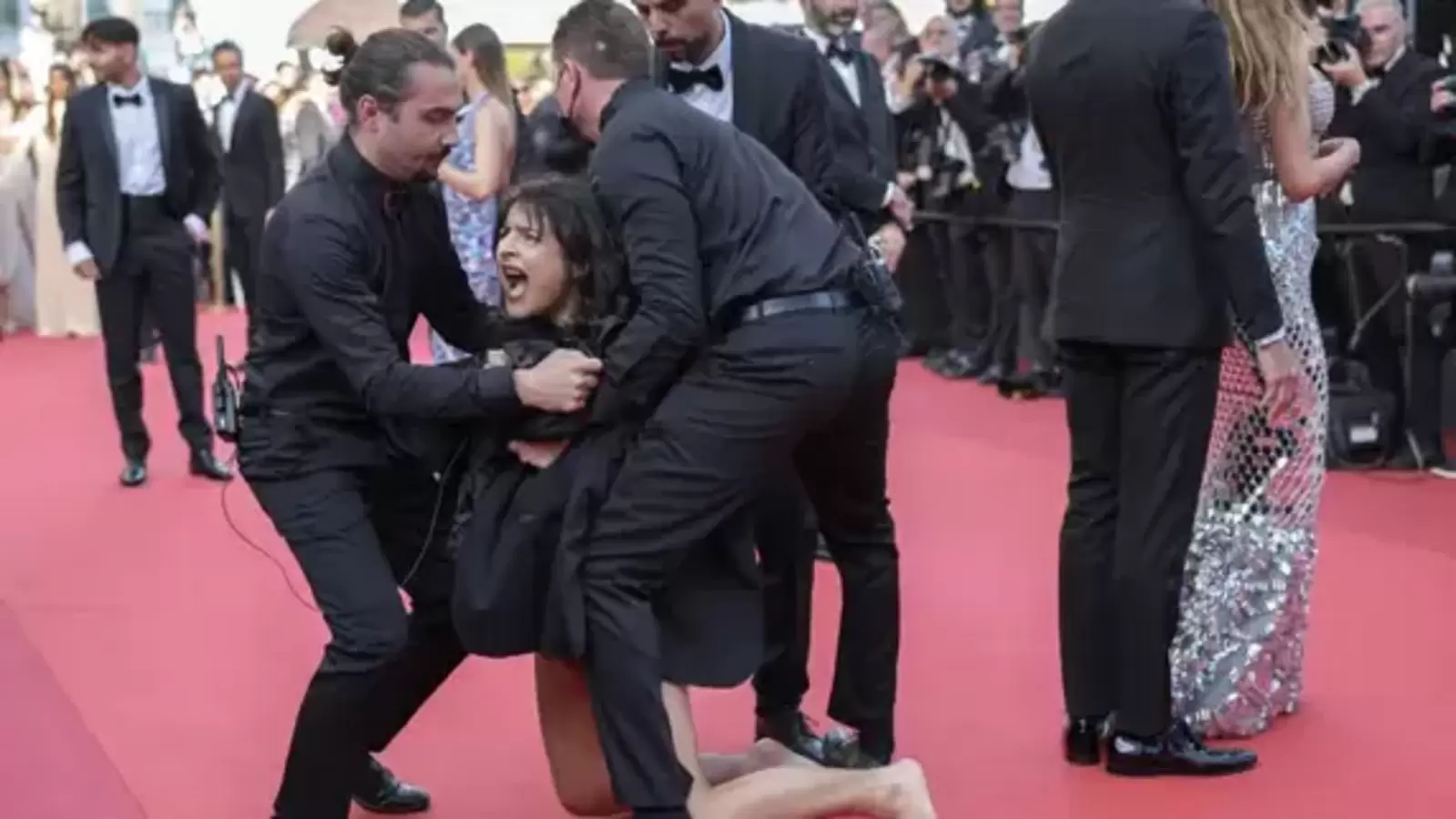 Woman removed from Cannes Film Festival red carpet after she protests against sexual violence in Ukraine