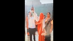 Screengrab from viral video of the bride and groom firing gunshot in the air in Agra.