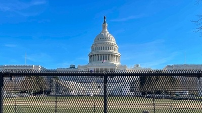US National Guard soldiers guard the grounds of the US Capitol from behind a security fence in Washington, DC. (AFP) US National Guard soldiers guard the grounds of the US Capitol from behind a security fence in Washington, DC. (AFP)