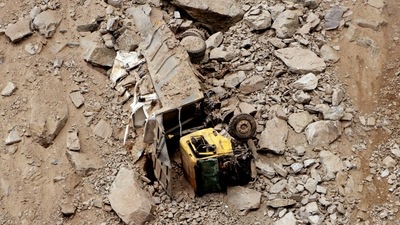A vehicle is completely damaged after the collapse of an under-construction tunnel on the Jammu-Srinagar national highway near Khooni Nallah, in Ramban. (ANI Photo) (Imran Nissar)