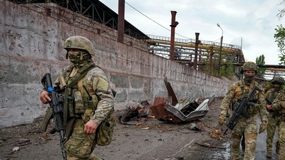 Ukraine war: Russian soldiers patrol a destroyed part of the Illich Iron & Steel Works Metallurgical Plant in Mariupol, in territory under the government of the Donetsk People's Republic, eastern Ukraine, (AP) Ukraine war: Russian soldiers patrol a destroyed part of the Illich Iron & Steel Works Metallurgical Plant in Mariupol, in territory under the government of the Donetsk People's Republic, eastern Ukraine, (AP)