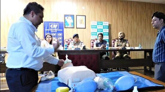 Life-saving techniques being demonstrated in a session held by CII in Ludhiana. (HT PHOTO)