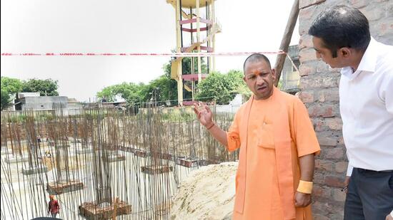 Uttar Pradesh chief minister Yogi Adityanath inspecting the under construction site of Ram temple in Ayodhya on May 6, 2022. (PTI)