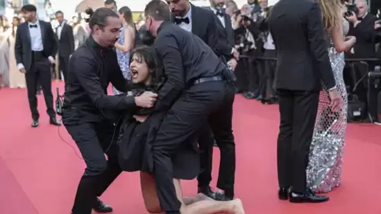 Woman storms Cannes red carpet to protest against sexual violence in  Ukraine | Hollywood - Hindustan Times