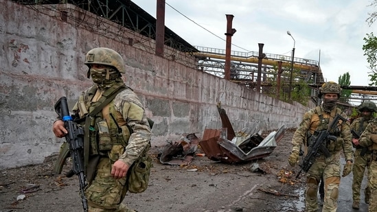 Ukraine war: Russian soldiers patrol a destroyed part of the Illich Iron &amp; Steel Works Metallurgical Plant in Mariupol, in territory under the government of the Donetsk People's Republic, eastern Ukraine,(AP)