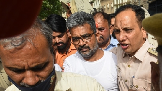Delhi University professor Ratan Lal, who was earlier arrested for his social post on the Shivling allegedly found in Gyanvapi Mosque, being produced in the Tis Hazari Court in New Delhi. ((Sanchit Khanna/HT)) Delhi University professor Ratan Lal, who was earlier arrested for his social post on the Shivling allegedly found in Gyanvapi Mosque, being produced in the Tis Hazari Court in New Delhi. ((Sanchit Khanna/HT))