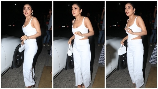 Shehnaaz chose an all-white ensemble for the occasion, and it screamed elegance mixed with trendy vibes. Her fit for the party features a sleeveless corset top with a plunging neckline and back, structured boning to hug Shehnaaz's curves, asymmetrical cropped hemline, and a fitted bodice.(HT Photo/Varinder Chawla)