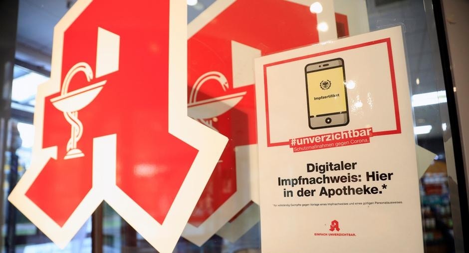 A sign advertises Germany's COVID-19 vaccine certificate app at a pharmacy (Sebastian Gabsch/Geisler-Fotopress/picture alliance) A sign advertises Germany's COVID-19 vaccine certificate app at a pharmacy (Sebastian Gabsch/Geisler-Fotopress/picture alliance)