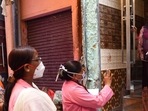 ASHA workers on a door-to-door screening survey for Covid. (HT file) ASHA workers on a door-to-door screening survey for Covid. (HT file)