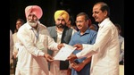 Telangana CM KCR, Delhi CM Arvind Kejriwal and Punjab CM Bhagwant Mann during a function to provide financial assistance to the kin of the farmers, who died during the protest over farm reform laws, in Chandigarh, Sunday. (PTI) Telangana CM KCR, Delhi CM Arvind Kejriwal and Punjab CM Bhagwant Mann during a function to provide financial assistance to the kin of the farmers, who died during the protest over farm reform laws, in Chandigarh, Sunday. (PTI)