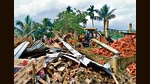 A bulldozer razes a house in Nagaon, Assam, on Sunday. (ANI) A bulldozer razes a house in Nagaon, Assam, on Sunday. (ANI)