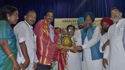 Punjab assembly speaker Kultar Singh Sandhwan being welcomed at Guru Nanak Bhawan in Ludhiana. (Harvinder Singh/HT)