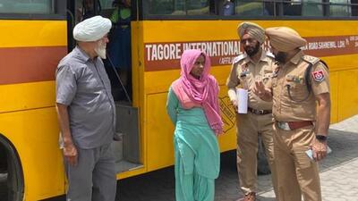Police officials interacting with a school bus driver and staff member in Ludhiana to apprise them of rules and recommendations of Safe School Vahan Policy on Sunday. (HT PHOTO)
