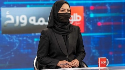 A woman presenter for Tolo News, Sonia Niazi, covers her face in a live broadcast at Tolo TV station in Kabul on Sunday. (AFP) A woman presenter for Tolo News, Sonia Niazi, covers her face in a live broadcast at Tolo TV station in Kabul on Sunday. (AFP)