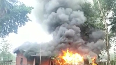 Visuals of Assam police station wrapped in flames were shared by ANI. Visuals of Assam police station wrapped in flames were shared by ANI. 
