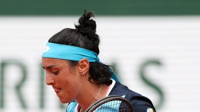 Tunisia's Ons Jabeur reacts during her first round match against Poland's Magda Linette&nbsp; (REUTERS)