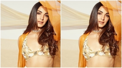 Kiara styled the ensemble with minimal accessories. She went for strappy silver heels and a choker necklace decked with orange beads and shimmering white gemstones. (Instagram) Kiara styled the ensemble with minimal accessories. She went for strappy silver heels and a choker necklace decked with orange beads and shimmering white gemstones. (Instagram)