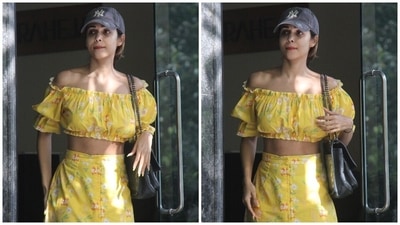 Today, yellow was Malaika's go-to hue, and it came decorated with floral patterns in white, green and red shades. The Chaiyya Chaiyya girl styled the coordinated set with a grey printed baseball cap, black textured shoulder bag and beige and white slip-on sandals from Chloe. (HT Photo/Varinder Chawla) Today, yellow was Malaika's go-to hue, and it came decorated with floral patterns in white, green and red shades. The Chaiyya Chaiyya girl styled the coordinated set with a grey printed baseball cap, black textured shoulder bag and beige and white slip-on sandals from Chloe. (HT Photo/Varinder Chawla)