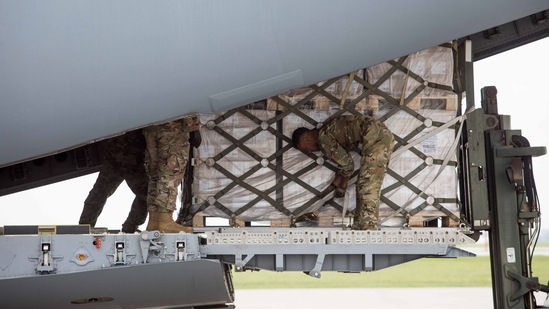 Pallets of Nestle Health Science Alfamino Infant and Alfamino Junior formula are unloaded from a US military aircraft at Indianapolis International Airport in Indianapolis, Indiana.(Bloomberg)
