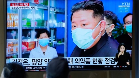FILE - People watch a TV screen showing a news program reporting with an image of North Korean leader Kim Jong Un, at a train station in Seoul, South Korea on May 16, 2022. North Korean propaganda describes an all-out effort to fight a suspected COVID-19 outbreak that has sickened nearly 2 million people. But defectors say fear is palpable among North Korean citizens who lack access to hospital care and struggle to afford even basic medicine.&nbsp;(AP)